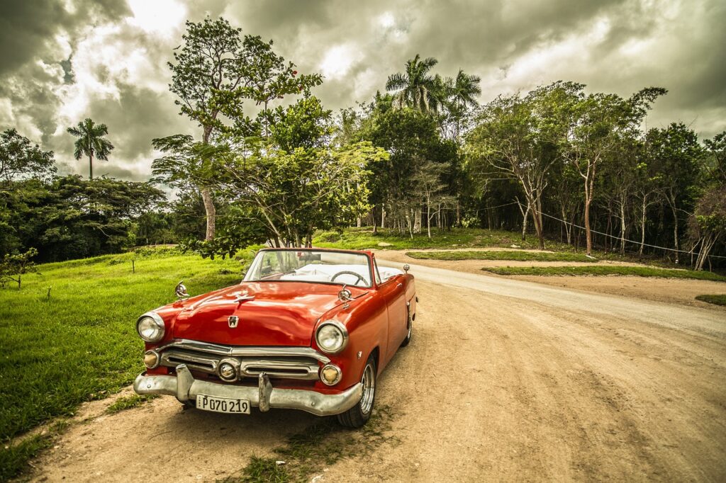 red car on dirt road