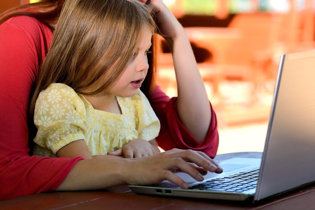 mother and child on laptop