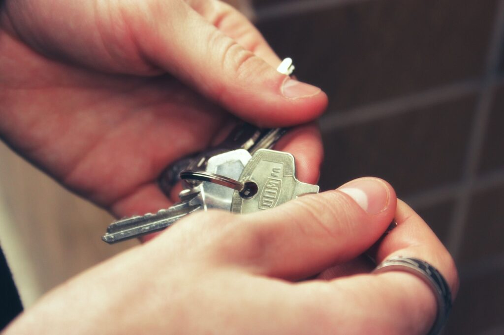 person holding their keys