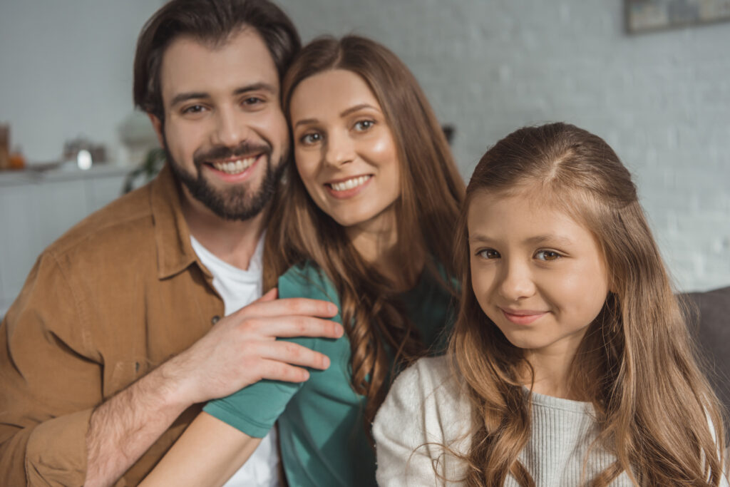 family posing for photo