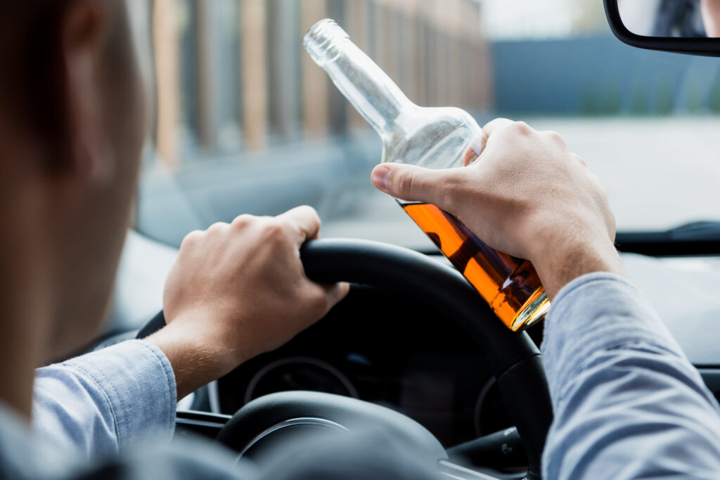 Man drinking while driving