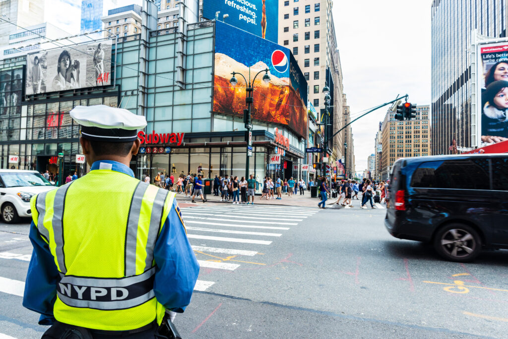 NYPD officer standing in the street