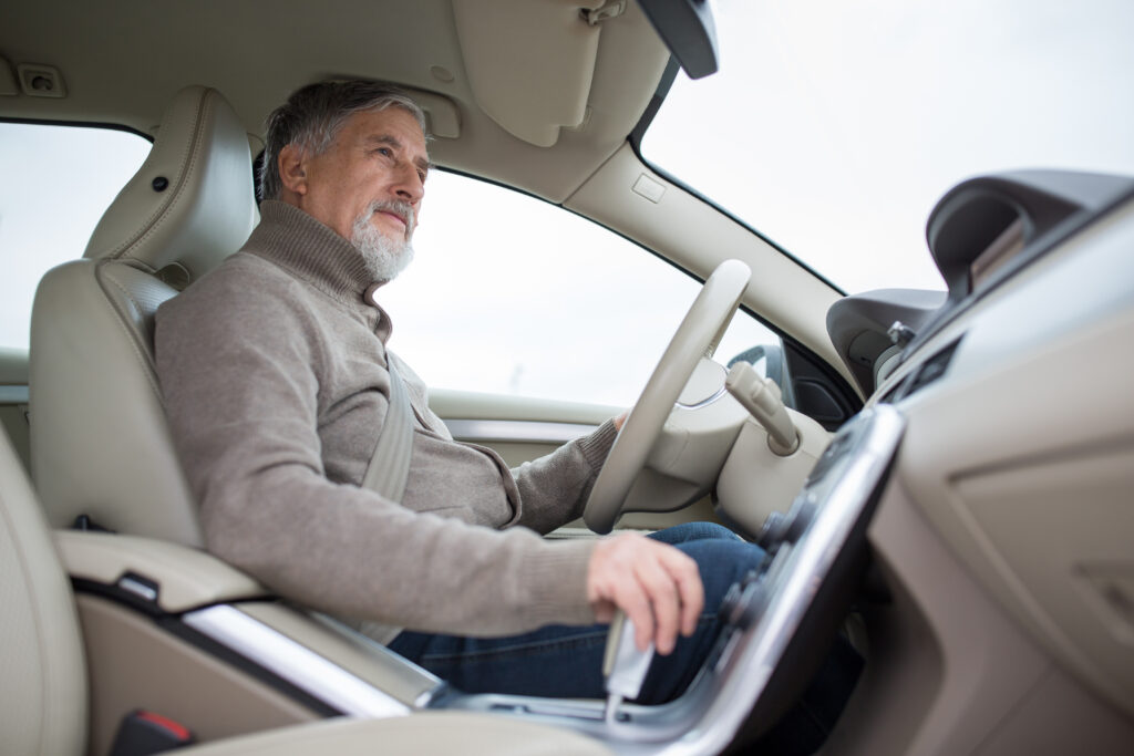 50 year old driver in his car