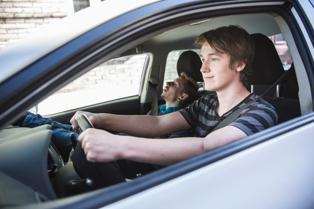 Teenage boy driving his car