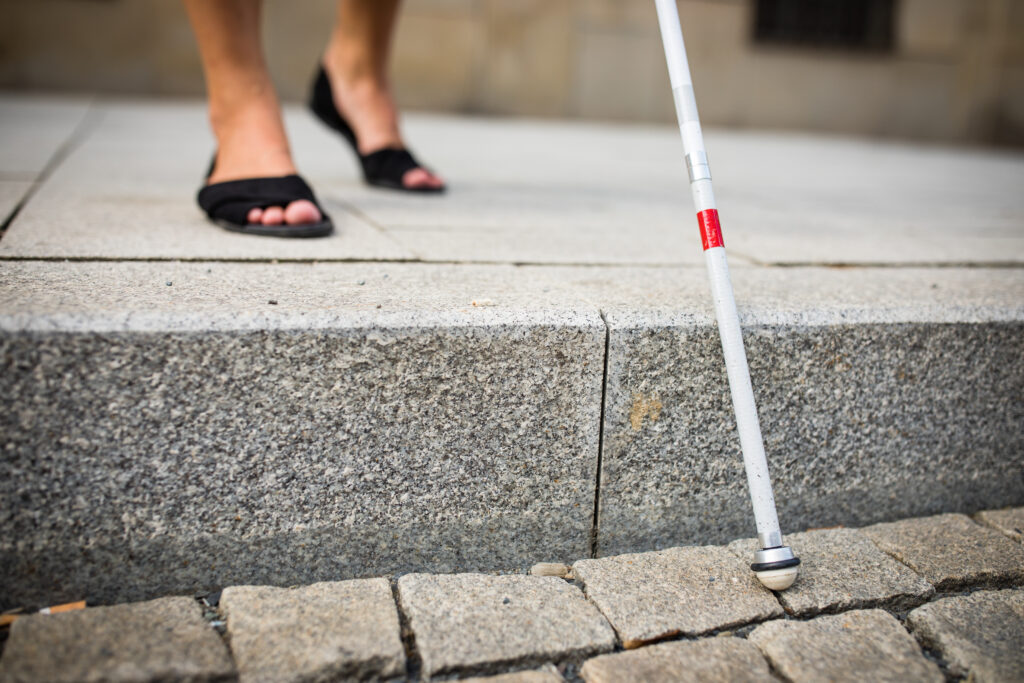 Blind woman walking on city streets