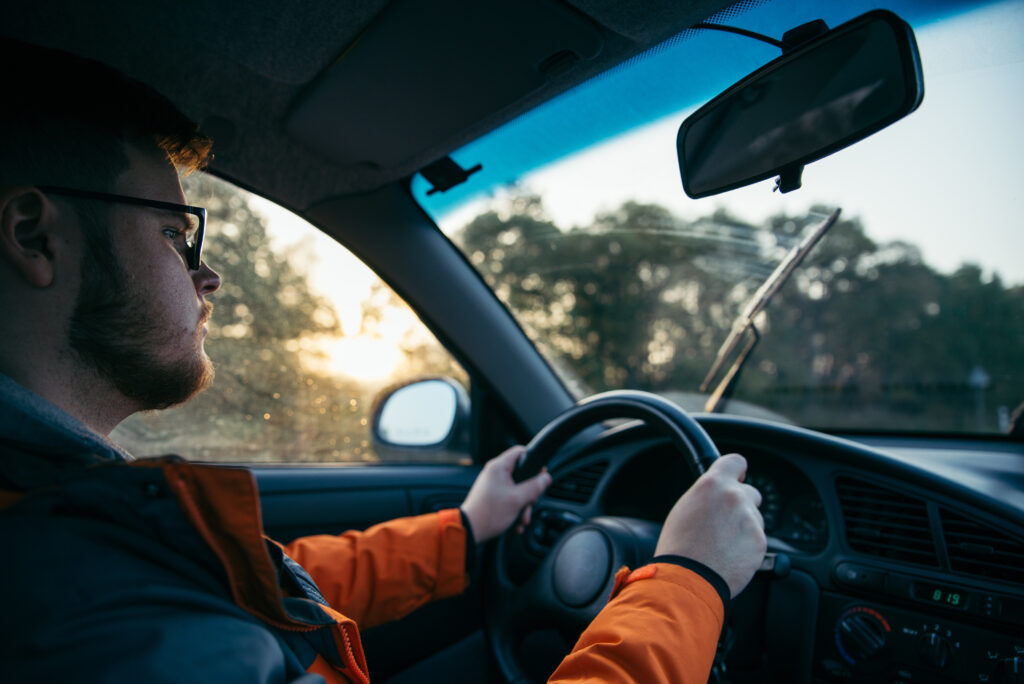 man driving car