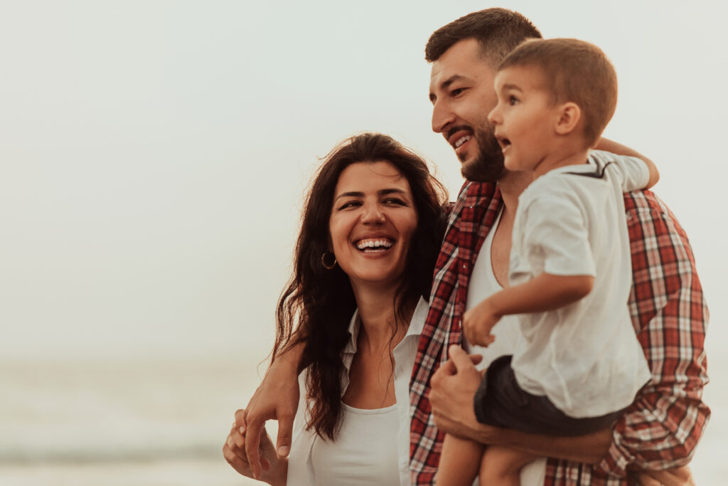 Family smiling while on a walk