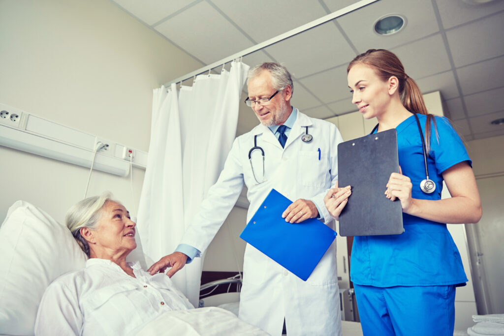 doctor and nurse visiting senior patient woman