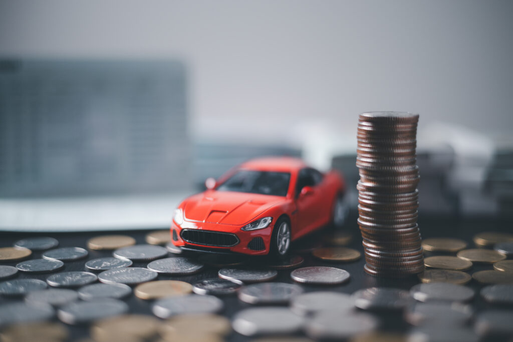 model car on stack of coins